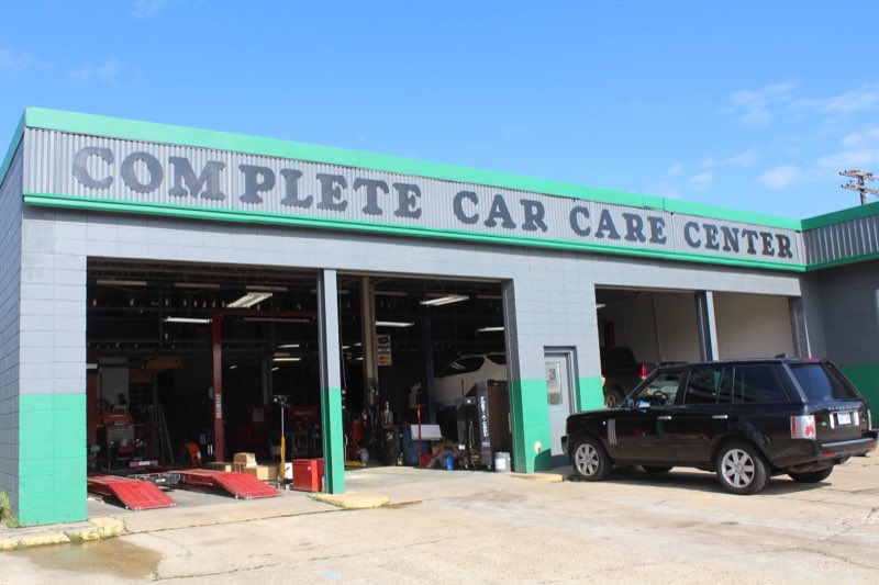 Complete Car Care Center service bays with lifts and an alignment rack